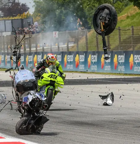 The motorcycle of Team Gresini Racing’s Alex Marquez tumbles and breaks apart in front of Team Pertamina Enduro VR46 Racing’s Fabio Di Giannantonio during the MotoGP Catalunya Grand Prix at the Catalunya racetrack on Sunday.—AFP