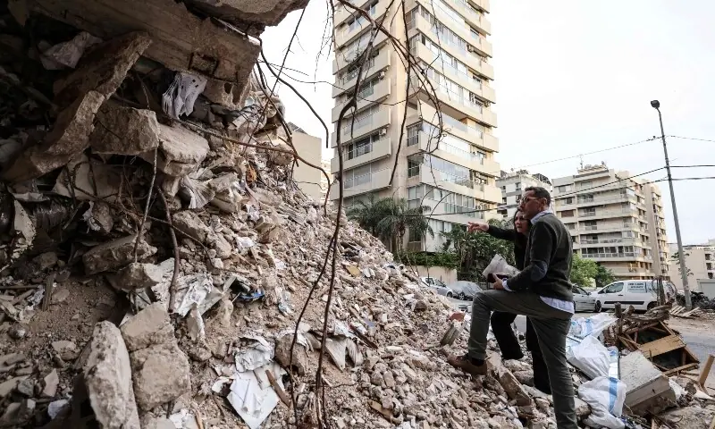 Ghida Krisht and Wael Sabbagh inspect the rubble of a building destroyed by an Israeli strike in Beirut&rsquo;s Tallet el-Khayyet neighbourhood on May 18, 2026. &mdash;AFP