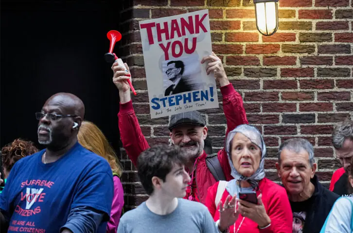 A PERSON holds a sign outside the Ed Sullivan Theater, where the last show of Stephen Colbert’s Late Show was filmed.—Reuters