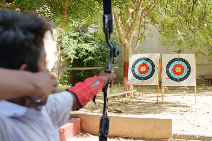 A student learning archery at VM Public School