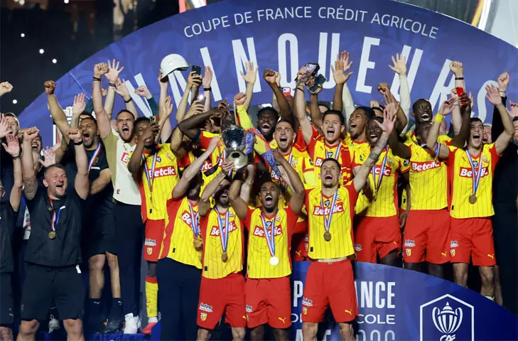 PARIS: RC Lens players celebrate with the French Cup trophy after defeating Nice in the final at Stade de France.—Reuters