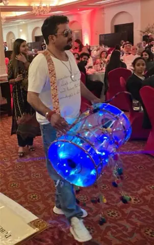  Artist Jimmy the Dholwala entertains the audience with his illuminated see-through Dhol during the Asian Study Group gala &lsquo;Colours of Pakistan&rsquo; in Islamabad on Saturday. &mdash; Dawn  