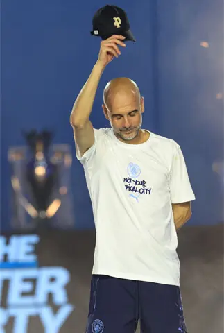 OUTGOING Manchester City coach Pep Guardiola reacts at an after-party event with the players after their victories in the two domestic cup competitions.—AFP