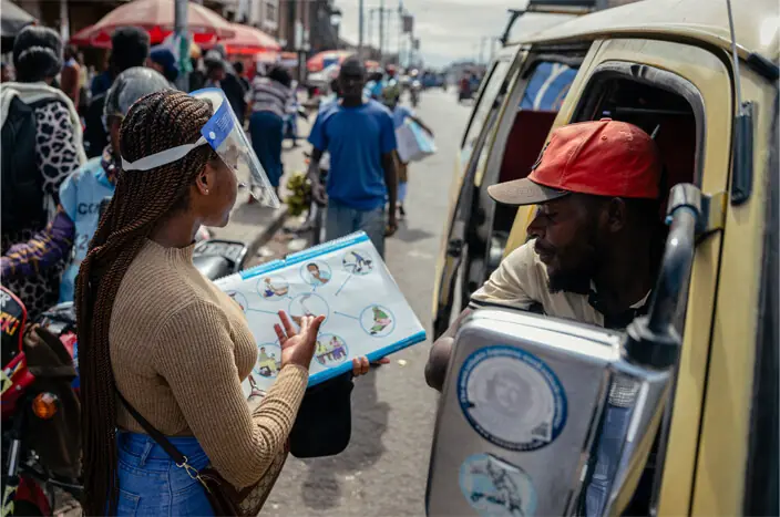VOLUNTEERS carry out awareness activities at a market in Goma, as DR Congo struggles to contain the outbreak.—AFP