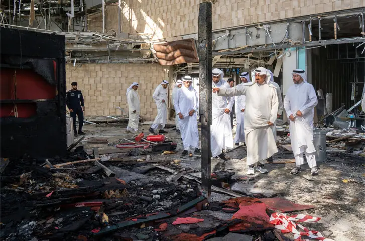  Kuwaiti Prime Minister Sheikh Ahmad al-Abdullah al-Sabah (2nd from right) inspects damage to the airport after an Iranian attack resulted in one death and left dozens injured.&mdash;AFP 