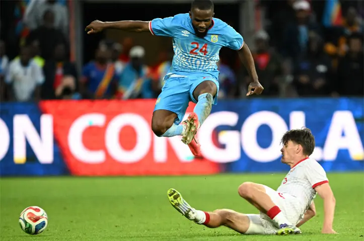  LIEGE (Belgium): DR Congo&rsquo;s Gedeon Kalulu (top) vies for the ball with Joakim Maehle of Denmark during their international friendly at the Stade Maurice Dufrasne.&mdash;AFP 