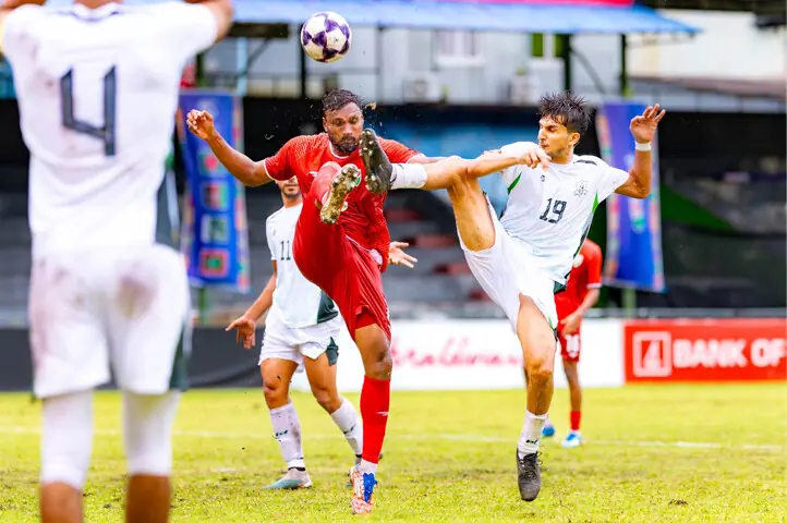  PAKISTAN&rsquo;S Hayyan Khattak (R) in action during the Diamond Jubilee International Football Tournament match against the Maldives at the National Stadium on Thursday.&mdash;Courtesy PFF 