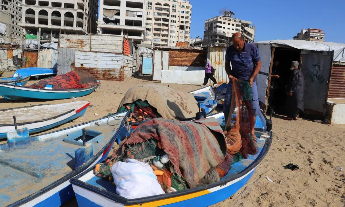 A Palestinian fisherman checks his net on the beach in Gaza City on June 3, 2026. —Reuters