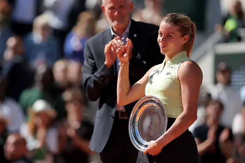 Poland’s Maja Chwalinska poses with the runners up trophy on the podium at the end of her women’s final singles match against Russia’s Mirra Andreeva on day 14 of the French Open tennis tournament. — AFP