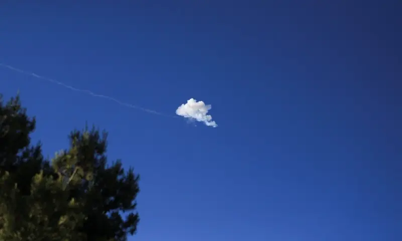 Smoke from an explosion in the sky after the Iron Dome anti-missile system intercepted an Iranian missile, as seen from Jerusalem, June 8, 2026. &mdash;Reuters