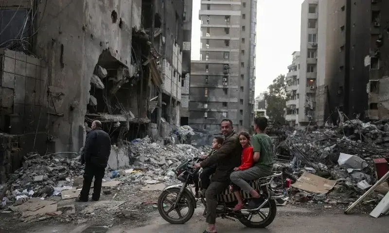 A family visits the site of an Israeli airstrike, carried out on April 8, following the 10-day ceasefire between Lebanon and Israel, at Corniche al-Mazraa in Beirut, Lebanon, April 19, 2026. —Reuters