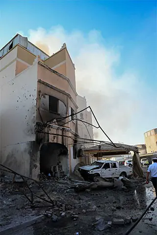  BAHRAIN: A damaged building and vehicle are seen in the aftermath of Iranian drone attacks.—Reuters 