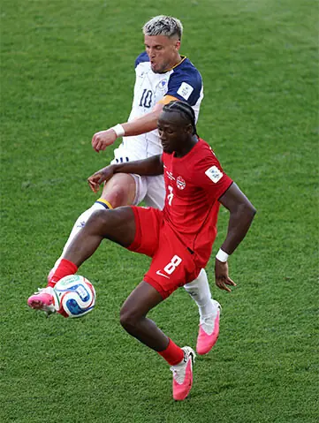  Ismael Kone of Canada is challenged by Ermedin Demirovic of Bosnia and Herzegovina during the FIFA World Cup 2026 Group B match.&mdash;AFP 