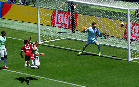 SANTA CLARA: Qatar’s Boualem Khoukhi (L) heads to score against Switzerland during their Group ‘B’ match at San Francisco Bay Area Stadium.—Reuters