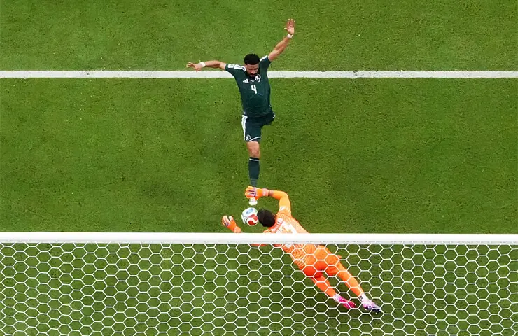 MIAMI GARDENS (Florida): Saudi Arabia’s Abdulelah Al-Amri scores past Uruguay goalkeeper Fernando Muslera during their Group ‘H’ match at the Miami Stadium.—Reuters