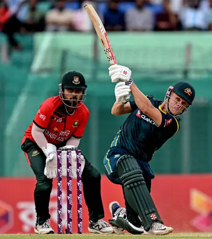 Australian opener Cooper Connolly (C) plays a stroke during the first T20 International against Bangladesh at the Bir Sreshtho Flight Lieutenant Matiur Rahman Stadium on Wednesday.—AFP