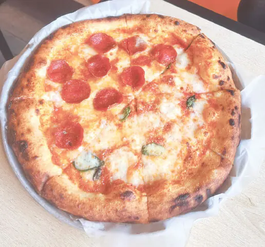 The order that arrived first: pepperoni with hot honey and margherita pizza (half and half)