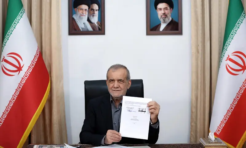 Iranian President Masoud Pezeshkian shows the document to the media.—AFP/Reuters
