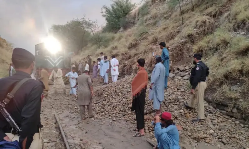 Emergency maintenance teams work on clearing debris from the railway track in Attock’s Jand tehsil on June 19. — photo via author