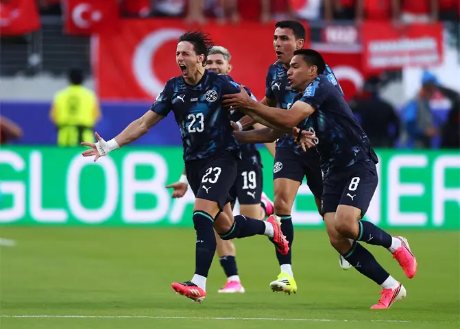 SANTA CLARA: Paraguay’s Matias Galarza (L) celebrates with team-mates after scoring against Turkiye.—AFP