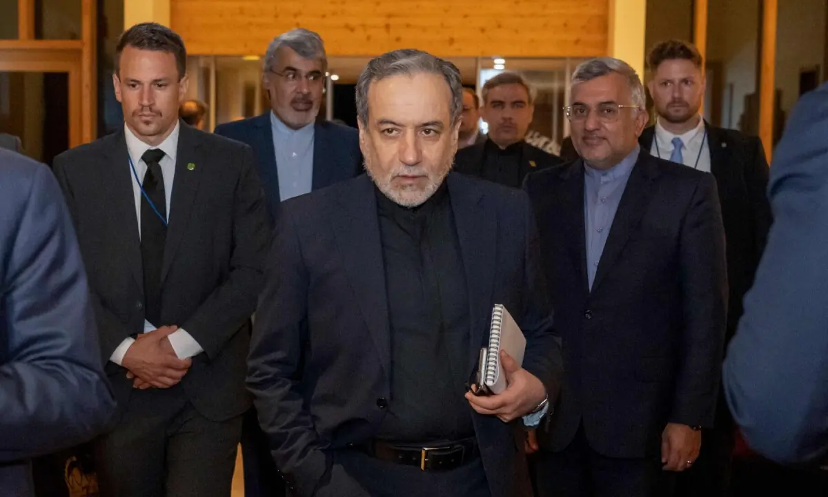 Iran’s Minister of Foreign Affairs Seyyed Abbas Araghchi (C) arrives at the Burgenstock resort in Obbuergen, near Lucerne on June 21, 2026. ─ Reuters