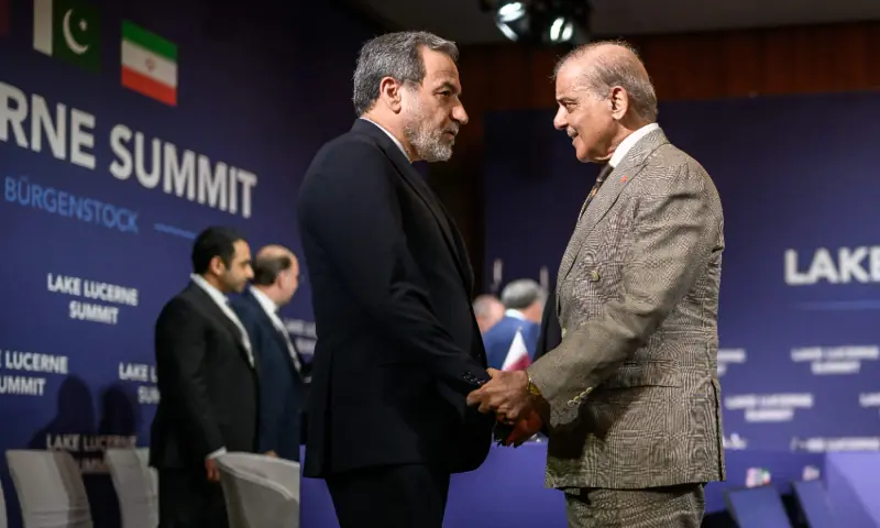 Iran&rsquo;s Foreign Minister Abbas Araghchi (L) shakes hands with Pakistan&rsquo;s Prime Minister Shehbaz Sharif ahead of a quadrilateral meeting between the United States, Iran, Pakistan and Qatar at the Burgenstock luxury hotel complex overlooking Lake Lucerne, Switzerland, on June 21, 2026. &mdash; AFP