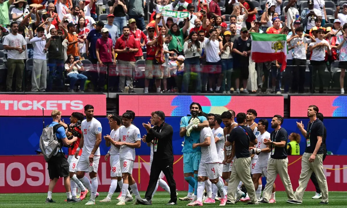  Iran&rsquo;s players celebrate at the end of the 2026 World Cup Group G football match between Belgium and Iran at the Los Angeles Stadium in Inglewood on June 21, 2026. &mdash; AFP 