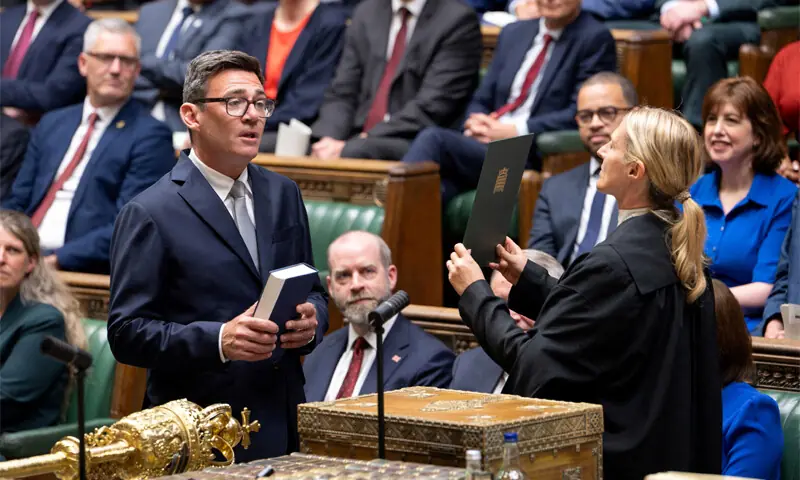 Labour leadership hopeful Andy Burnham is sworn in as an MP in the House of Commons.—AFP/Reuters