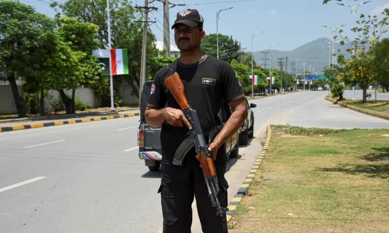  A police officer stands guard on a road leading to the Serena Hotel ahead of the arrival of Iran&rsquo;s President Masoud Pezeshkian in Islamabad, Pakistan, June 23. &mdash; Reuters 
