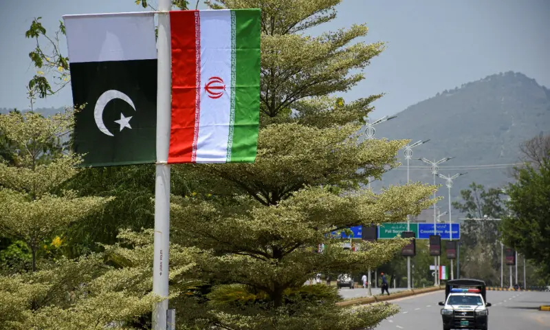  Iranian and Pakistani national flags are displayed along a street ahead of the arrival of Iran&rsquo;s President Masoud Pezeshkian in Islamabad, Pakistan, June 23. &mdash; Reuters 