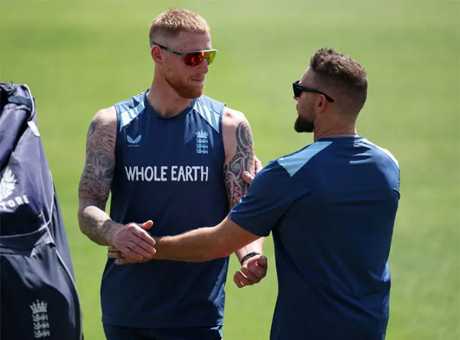 ENGLAND captain Ben Stokes (L) interacts with head coach Brendon McCullum during a practice session at Trent Bridge on Tuesday.—Reuters