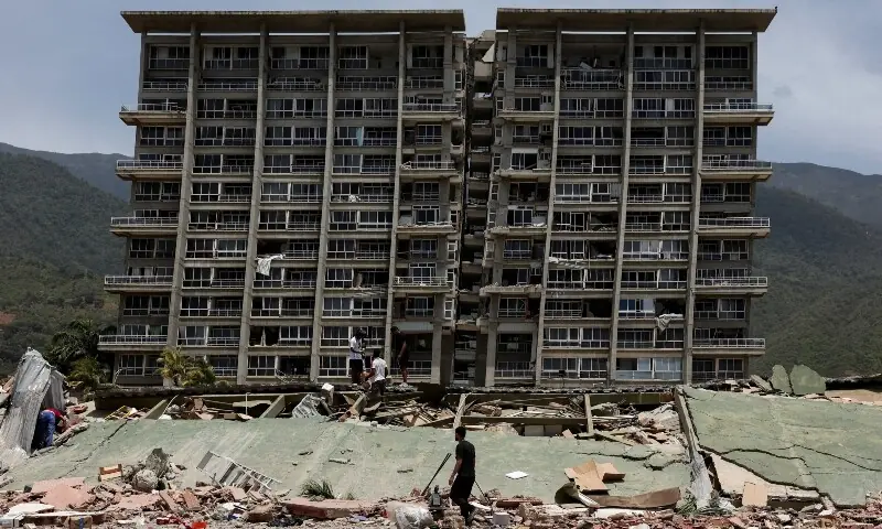People inspect the rubble of a collapsed building after earthquakes hit the country, in La Guaira, Venezuela, June 25, 2026. &mdash;Reuters/File