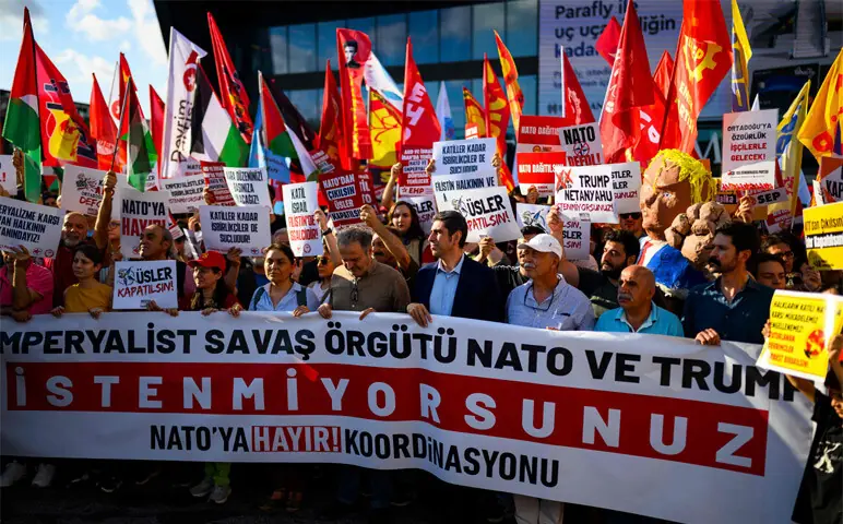  Istanbul: Protesters hold banners, flags and placard during a leftist anti-Nato demonstration.&mdash;AFP 