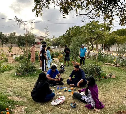  Residents and their pets at the local park, where informal baithaks hang-outs are also held | Mahera Omar 