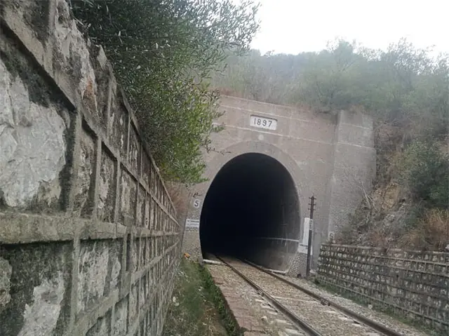  A plaque at the entrance of a railway tunnel displays the year it was constructed.  