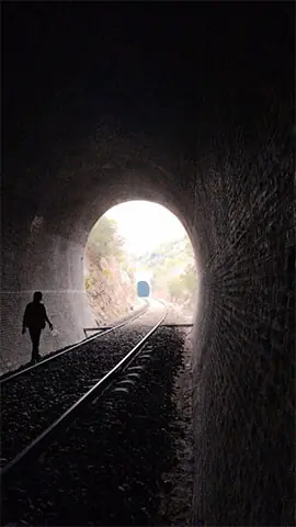  A man walks through one of the railway tunnels, a favourite destination for adventure enthusiasts and expedition teams. 