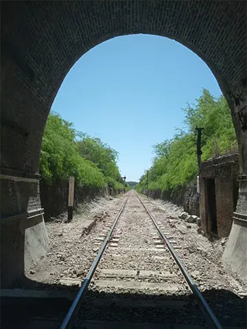  The railway track emerges from one of the tunnels. 