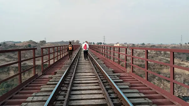  Two visitors walk across a railway bridge dating back to the colonial era. &mdash; Photos by the writer 