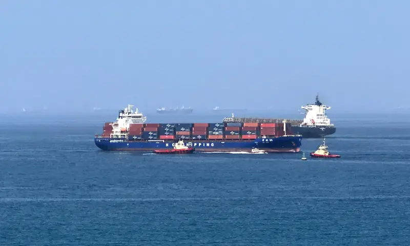 A cargo ship is pictured off coast of the Khor Fakkan Container Terminal, the only natural deep-sea port in the region and one of the major container ports in Sharjah Emirate, along the Gulf of Oman on June 28, 2026. &mdash; AFP
