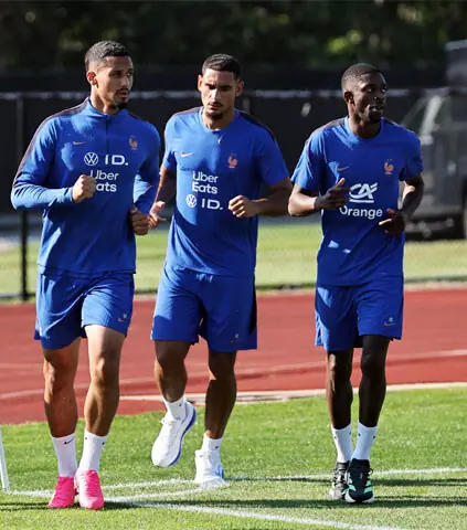  BOSTON (Massachusetts): (From L) France&rsquo;s William Saliba, Maxence Lacroix and Ousmane Dembele warm up during a practice session at the Bentley University.&mdash;Reuters 