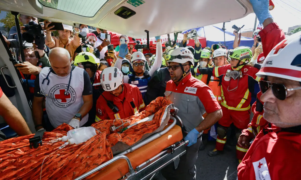 Rescuers dig out Venezuelan man eight days after quakes; death toll nears 2,300