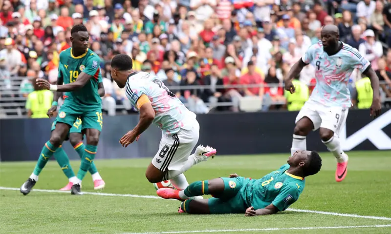  Belgium&rsquo;s Youri Tielemans is fouled by Senegal&rsquo;s Lamine Camara in the penalty box during their round-of-32 match at the Seattle Stadium.&mdash;AFP 