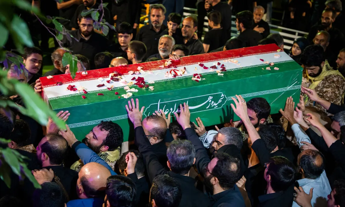Mourners carry the coffin of Zahra Haddad Adel, wife of Iran’s supreme leader Mojtaba Khamenei, during her funeral in Tehran. — AFP