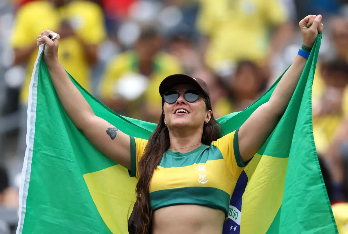 A Brazil fan poses with the country’s flag at the New York New Jersey Stadium in East Rutherford, New Jersey on July 5, 2026.—AFP