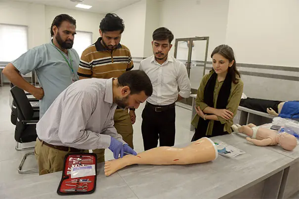  Students are being shown how to stitch wounds. &mdash; Photos by Mohammad Asim 
