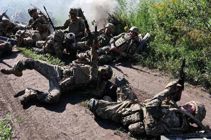 Ukrainian servicemen aim their rifles at an aerial target as they take part in a military training exercise.—AFP