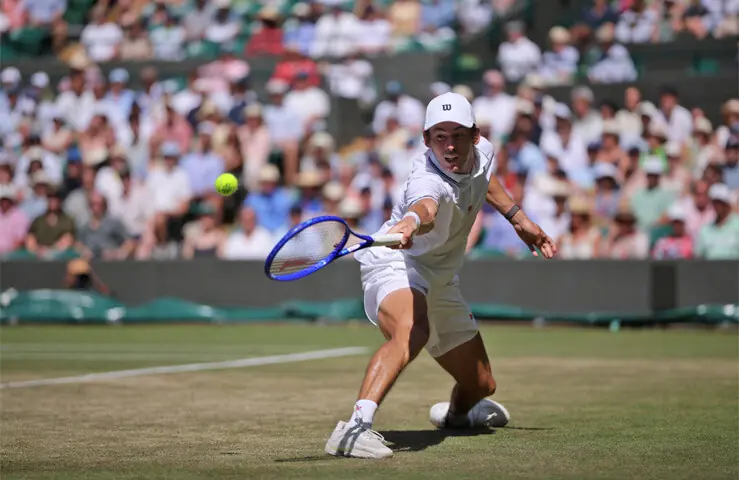 LONDON: Australia’s Alex de Minaur in action against Flavio Cobolli of Italy during their Wimbledon fourth-round match at the All England Lawn Tennis and Croquet Club on Monday.—Reuters