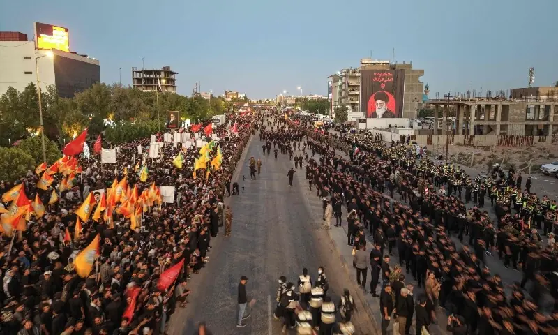People gather on the day of a funeral procession for Iran&rsquo;s late Supreme Leader Ayatollah Ali Khamenei, who was killed on February 28 in Israeli and US airstrikes, at the Imam Ali Shrine in Najaf, Iraq, July 8, 2026. &mdash;AFP