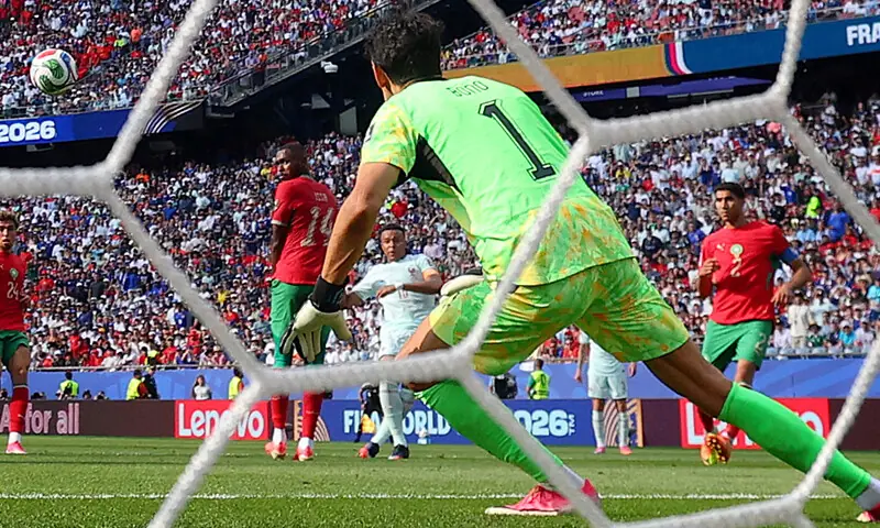 FRANCE’S Kylian Mbappe (second R) scores past Morocco goalkeeper Yassine Bounou during their quarter-final at the Boston Stadium.—Reuters