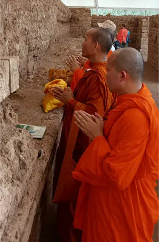 Thai monks perform rituals at Dharmarajika Stupa in Taxila on Saturday. — Dawn